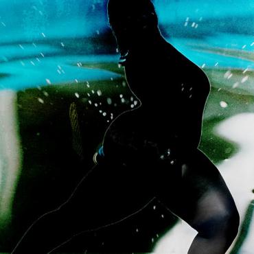 Image description: Silouhette of woman against abstract background.