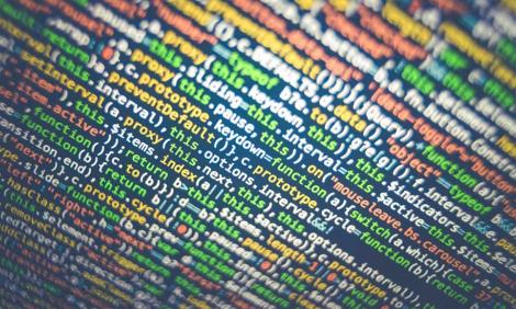 Image description: Close-up of colourful binary code