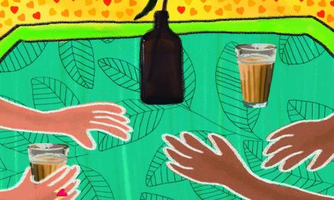 Two pairs of hands holding cups of chai