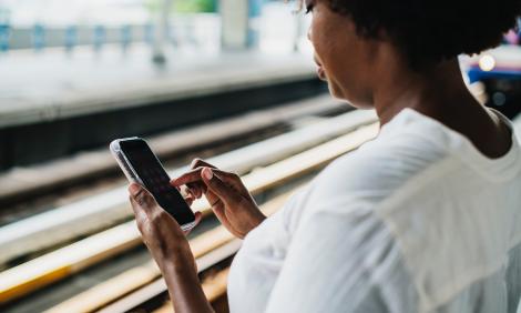Woman looking at phone: photograph