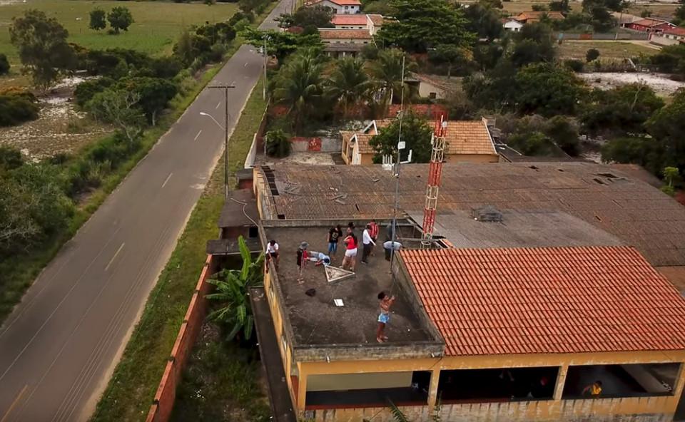 people installing a community antenna in a roof
