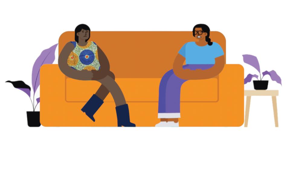 two women talking in a couch