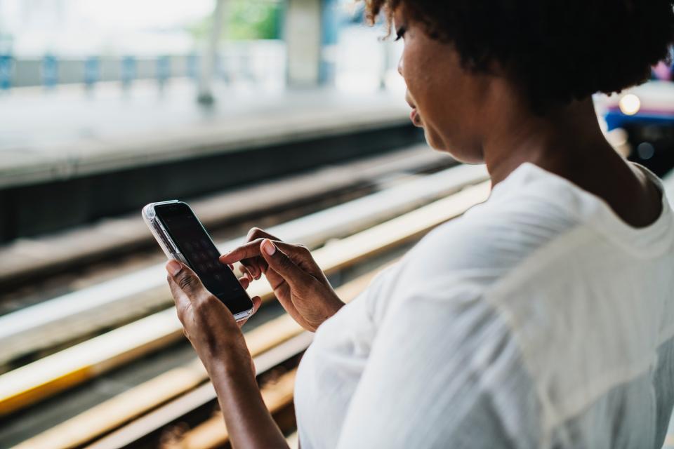 Woman looking at phone: photograph